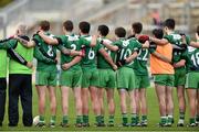 26 October 2014; Members of the St Patrick's squad stand for a minute's silence for former player Eamon Carroll ahead of the game. AIB Leinster GAA Football Senior Club Championship, First Round, Rhode v St Patrick's, O'Connor Park, Tullamore, Co. Offaly. Picture credit: Ramsey Cardy / SPORTSFILE