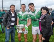26 October 2014; Moorefield players Éanna O'Connor, second from left, and his brother Cian, and their parents Jack and Bridie celebrate with Dermot Bourke Cup after the game. Kildare County Senior Football Championship Final Replay, Sarsfields v Moorefield. St Conleth's Park, Newbridge, Co. Kildare. Picture credit: Piaras Ó Mídheach / SPORTSFILE