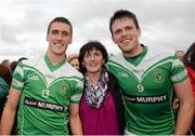 26 October 2014; Moorefield's Éanna O'Connor, left, and brother Cian, celebrate with their mother Bridie after the game. Kildare County Senior Football Championship Final Replay, Sarsfields v Moorefield. St Conleth's Park, Newbridge, Co. Kildare. Picture credit: Piaras Ó Mídheach / SPORTSFILE