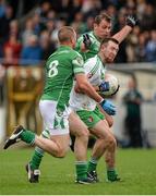26 October 2014; Robbie Confrey, Sarsfields, in action against Daryl Flynn, left, and Ross Glavin, Moorefield. Kildare County Senior Football Championship Final Replay, Sarsfields v Moorefield. St Conleth's Park, Newbridge, Co. Kildare. Picture credit: Piaras Ó Mídheach / SPORTSFILE
