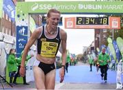 27 October 2014; Maria McCambridge, Dundrum South Dublin AC, crosses the finishing line in second place in the women's race at the SSE Airtricity Dublin Marathon 2014 and winner of the Irish Women's National Marathon Championship. Merrion Square, Dublin. Picture credit: Pat Murphy / SPORTSFILE