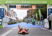 27 October 2014; Thomas Cornthwaite, from Lanchashire, England, after finishing the men's race at the SSE Airtricity Dublin Marathon 2014. Merrion Square, Dublin. Picture credit: Pat Murphy / SPORTSFILE