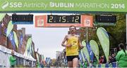27 October 2014; Dmitry Safronov, Russia, crosses the finishing in third place in the men's race at the SSE Airtricity Dublin Marathon 2014. Merrion Square, Dublin. Picture credit: Pat Murphy / SPORTSFILE