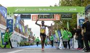 27 October 2014; Esther Wanjiru Macharia, Kenya, crosses the finishing line to win the women's race at the SSE Airtricity Dublin Marathon 2014. Merrion Square, Dublin. Picture credit: Pat Murphy / SPORTSFILE