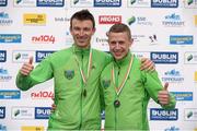 27 October 2014; Barry Minnock, Rathfarnham AC, the second Irish finisher in the men's race and Eoin Flynn, Rathfarnham AC, left, the third Irish finisher at the SSE Airtricity Dublin Marathon 2014. Merrion Square, Dublin. Picture credit: Pat Murphy / SPORTSFILE