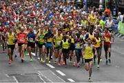 27 October 2014; Dmitry Safronov, Russia, leads the pack through Fitzwilliam Place at the start of the SSE Airtricity Dublin Marathon 2014. Fitzwilliam Place, Dublin. Picture credit: Ramsey Cardy / SPORTSFILE