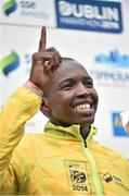 27 October 2014; Eliud Too, Kenya, celebrates on the podium after winning the SSE Airtricity Dublin Marathon 2014 in a time of 2:14:48. Merrion Square, Dublin. Picture credit: Ramsey Cardy / SPORTSFILE