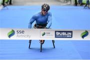 27 October 2014; Patrick Monahan, Naas, Co. Kildare, crosses the finish line to win the Wheelchair race at the SSE Airtricity Dublin Marathon 2014.  Picture credit: Ramsey Cardy / SPORTSFILE