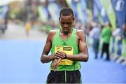 27 October 2014; Paul Koech Kimutai, Kenya, after finishing in second place in the men's race at the SSE Airtricity Dublin Marathon 2014. Merrion Square, Dublin. Picture credit: Ramsey Cardy / SPORTSFILE