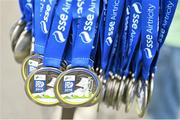 27 October 2014; Medals hang at the finish line awaiting the finish of the race at the SSE Airtricity Dublin Marathon 2014. Merrion Square, Dublin. Picture credit: Ramsey Cardy / SPORTSFILE