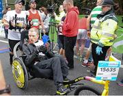 27 October 2014; Joseph and Ciaran Clifford from Co. Wicklow, after crossing the finish line during the SSE Airtricity Dublin Marathon 2014. Merrion Square, Dublin. Picture credit: Tomas Greally / SPORTSFILE