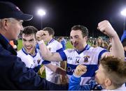 27 October 2014; Ciaran Dorney, right, and team-mate Mark Concarr celebrate with manager Tommy Conroy, left, following their side's victory, St Vincent’s. Dublin County Senior Football Championship Final, St Oliver Plunketts Eogha Rua v St Vincent's. Parnell Park, Dublin. Picture credit: Stephen McCarthy / SPORTSFILE