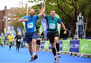 27 October 2014; Mark McGrath from Co. Wicklow and right, Alan Nolan from Galway city, approach the finish line, during the SSE Airtricity Dublin Marathon 2014. Merrion Square, Dublin. Picture credit: Tómas Greally / SPORTSFILE