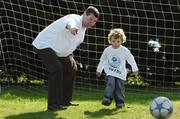 30 April 2007; Pictured at the launch of the 2007 Danone Nations Cup are Irish &quot;Godfather&quot; Denis Irwin, ex Republic of Ireland soccer international, and Rian Farrell, aged 3, from Dublin. The national finals are due to take place here at the AUL Complex, Clonshaugh, Dublin, on the 27th May 2007. AUL Complex, Clonshaugh, Dublin. Picture credit: David Maher/ SPORTSFILE