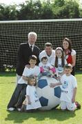 30 April 2007; Pictured at the launch of the 2007 Danone Nations Cup are, Irish &quot;Godfather&quot; Denis Irwin, ex Republic of Ireland soccer international, Martin O'Hanlon, General Secretary SFAI, Deirdre O'Leary, Brand Manager, Danone Ireland, with children from Dublin, from left, Clodagh Scully aged 5, Andrew Tobin, aged 11, 1 year old Alice Brannigan, Allanah Best, aged 9, and Brian Gleeson, aged 7. The national finals are due to take place here at the AUL Complex, Clonshaugh, Dublin, on the 27th May 2007. AUL Complex, Clonshaugh, Dublin. Picture credit: David Maher/ SPORTSFILE