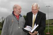 6 May 2007; Cyril Smyth, Honoury Treasurer of Wicklow Athletic Board, presents Olympic Champion Ronnie Delany with a special presentation book on the events of his Gold Medal performance in Melbourne on 1st December 1956. Big Track and Field Meet, Charlesland Sport & Recreation Park, Greystones, Co. Wicklow. Picture credit: Tomas Greally / SPORTSFILE