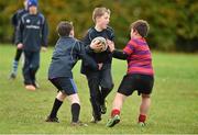 28 October 2014; Edward Hoey, centre, in action against  Oran Ledwith, left, and Pierce Griffin during the Leinster School of Excellence on Tour in Athboy RFC. Athboy RFC, Co. Meath. Picture credit: Barry Cregg / SPORTSFILE
