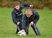 28 October 2014; Jeaic Murray, left, in action against Cóil O Muirí during the Leinster School of Excellence on Tour in Athboy RFC. Athboy RFC, Co. Meath. Picture credit: Barry Cregg / SPORTSFILE