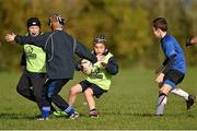 29 October 2014; Gráinne Keogh, centre, in action against Sean Tipper, extreme left, Cian Cosgrave and Aidan Henry, right, during the Leinster School of Excellence on Tour in Cill Dara RFC, Cill Dara RFC, Co. Kildare. Picture credit: Barry Cregg / SPORTSFILE