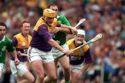 1 September 1996; Gary Laffan, Wexford, in action against Mike Nash, Limerick, Wexford v Limerick, All Ireland Hurling Final, Croke Park, Dublin. Picture credit; Ray McManus / SPORTSFILE