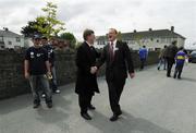 13 May 2007; Senators Donie Cassidy, left, and James Bannon greet each other as they canvass supporters arriving for the game. Bank of Ireland Leinster Senior Football Championship, Longford v Westmeath, Pearse Park, Longford. Picture credit: Ray McManus / SPORTSFILE