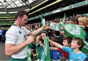 31 October 2014; Ireland's Peter O'Mahony  signs autographs for supporters after the open training session ahead of their Guinness Series Autumn Internationals against South Africa, Georgia and Australia. Ireland Rugby Open Training Session, Aviva Stadium, Lansdowne Road, Dublin. Picture credit: Matt Browne / SPORTSFILE