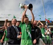 19 October 2014; Sarsfields captain Cian McConnell lifts the cup after the game. Kildare County Minor A Football Championship Final, Athy v Sarsfields. St Conleth's Park, Newbridge, Co. Kildare. Picture credit: Piaras Ó Mídheach / SPORTSFILE