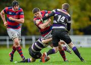 1 November 2014; Karl Moran, Clontarf, with support from team-mate Conor O'Keeffe, is tackled by James Thornton, left, and Shane Donovan, Terenure. Ulster Bank League, Division 1A, Terenure v Clontarf, Lakelands Park, Terenure, Dublin. Picture credit: Barry Cregg / SPORTSFILE