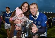 2 November 2014; Lar Corbett, Thurles Sarsfields, celebrates with the cup along with his wife Elaine and daughter Faye, five months old, after victory over Loughmore-Castleiney. Tipperary County Senior Hurling Championship Final, Loughmore-Castleiney v Thurles Sarsfields. Semple Stadium, Thurles, Co. Tipperary. Picture credit: Diarmuid Greene / SPORTSFILE
