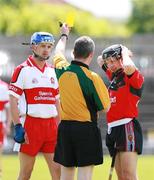 20 May 2007; Referee Joe Kelly shows the yellow cards to Derry's Peter O'Kane and Down's Eoin Clarke. Guinness Ulster Senior Hurling Championship Semi-Final, Down v Derry, Casement Park, Belfast, Co Antrim. Picture credit: Russell Pritchard / SPORTSFILE
