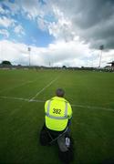 20 May 2007; A Steward takes a break to watch the match. Guinness Ulster Senior Hurling Championship Semi-Final, Down v Derry, Casement Park, Belfast, Co Antrim. Picture credit: Russell Pritchard / SPORTSFILE