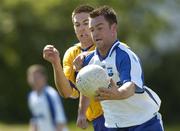 20 May 2007; Mick Ahearne, Waterford, in action against Gary Brennan, Clare. Bank of Ireland Munster Senior Football Championship Quarter-Final, Waterford v Clare, Fraher Field, Dungarvan, Co. Waterford. Picture credit: Matt Browne / SPORTSFILE