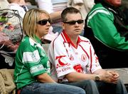 20 May 2007; A Fermanagh supporter and Tyrone supporter sit together at the match. Bank of Ireland Ulster Senior Football Championship Quarter-Final, Fermanagh v Tyrone, St Tighearnach's Park, Clones, Co Monaghan. Picture credit: Oliver McVeigh / SPORTSFILE