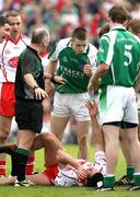 20 May 2007; Barry Owens, Fermanagh, urges Sean Cavanagh, Tyrone, to get up off the ground. Bank of Ireland Ulster Senior Football Championship Quarter-Final, Fermanagh v Tyrone, St Tighearnach's Park, Clones, Co Monaghan. Picture credit: Oliver McVeigh / SPORTSFILE