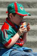 20 May 2007; Seven-year-old Cian Macken, from Ballindine, Co. Mayo, negotiates with a can of Fanta. Bank of Ireland Connacht Senior Football Championship, Galway v Mayo, Pearse Stadium, Galway. Picture credit: Ray McManus / SPORTSFILE