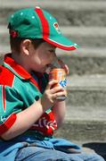20 May 2007; Seven-year-old Cian Macken, from Ballindine, Co. Mayo, negotiates with a can of Fanta. Bank of Ireland Connacht Senior Football Championship, Galway v Mayo, Pearse Stadium, Galway. Picture credit: Ray McManus / SPORTSFILE