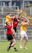 26 May 2007; Antrim's PJ McConnell and Brendan Cousins in action against Donal Ennis and Padraig Flynn, Down. ESB Ulster Minor Hurling Champoinship Final, Antrim v Down, Casement Park, Belfast, Co. Antrim. Picture credit; Oliver McVeigh / SPORTSFILE