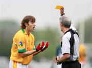 27 May 2007; Colin Regan, Leitrim, gets shown the yellow card by referee Michael Hughes, Tyrone. Bank of Ireland Connacht Senior Football Championship, London v Leitrim, Emerald Gaelic Grounds, Ruislip, London, England. Picture credit: Russell Pritchard / SPORTSFILE
