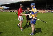 27 May 2007; Team captains Kieran Murphy, left, Cork, and Frank Lohan, Clare, shake hands in front of referee Pat O'Connor before the game. Guinness Munster Senior Hurling Championship Quarter-Final, Cork v Clare, Semple Stadium, Thurles, Co. Tipperary. Picture credit: Brendan Moran / SPORTSFILE