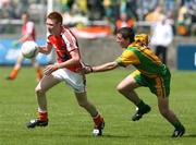 27 May 2007; Tony Donnelly, Armagh, in action against Kevin Mulhern, Donegal. ESB Ulster Minor Football Championship, Donegal v Armagh, MacCumhaill Park, Ballybofey, Co. Donegal. Picture credit: Oliver McVeigh / SPORTSFILE