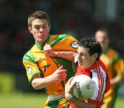 27 May 2007; Jamie Clarke, Armagh, in action against Declan Walsh, Donegal. ESB Ulster Minor Football Championship, Donegal v Armagh, MacCumhaill Park, Ballybofey, Co. Donegal. Picture credit: Oliver McVeigh / SPORTSFILE