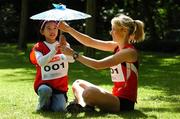 29 May 2007; Ireland's top athlete Derval O'Rourke with Mitsue Kitagawa, aged 8, at a SPAR Media Conference ahead of the 11th IAAF World Championships. The 11th IAAF World Championships in Athletics 2007 will be held at Osaka, Japan, for nine days from the 24th August  to the 2nd September 2007. Merrion Square Park, Dubin. Picture credit: David Maher / SPORTSFILE