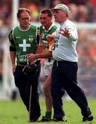 13 September 1998; Billy Dooley of Offaly is helped off the field by manager Michael Bond, right, during the Guinness All-Ireland Senior Hurling Championship Final between Offaly and Kilkenny at Croke Park in Dublin. Photo by Ray McManus/Sportsfile