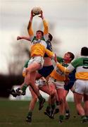 23 January 2000; Offaly's Ciaran McManus outjumps Longford's Enda Barden during the O'Byrne Cup Semi-Final match between Longford and Offaly at Pearse Park in Longford. Photo by Ray McManus/Sportsfile