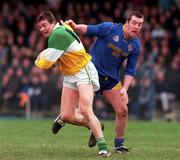 23 January 2000;Ciaran McManus of Offaly in action against Enda Barden of Longford during the O'Byrne Cup Semi-Final match between Longford and Offaly at Pearse Park in Longford. Photo by Aoife Rice/Sportsfile