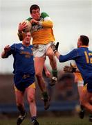 23 January 2000; Offaly's Ciaran McManus outjumps Longford's Enda Barden and Paul Ross, 12, during the O'Byrne Cup Semi-Final match between Longford and Offaly at Pearse Park in Longford. Photo by Ray McManus/Sportsfile