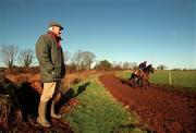 14 January 2000; Trainer Tom Foley watches Danoli during the morining training run on the gallops at his Aghabeg Yard in Bagenalstown, Carlow. Photo by Matt Browne/Sportsfile