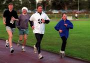 25 December 1999; Participants, including former World 5,000m Champion Eamonn Coghlan and his son John, at Belfield Running Track in Dublin, during one of the many 'Goal Miles' on Christmas Day. Photo by Ray McManus/Sportsfile