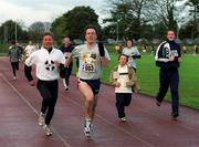 25 December 1999; Participants, including former World 5,000m Champion Eamonn Coghlan, left, at Belfield Running Track in Dublin, during one of the many 'Goal Miles' on Christmas Day. Photo by Ray McManus/Sportsfile
