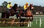 28 December 1998: Deejaydee, with Paul Hourigan up, right, clears the last on the way to winning the the O'Dwyer's Stillorgan Orchard Novice Hurdle from Bay Magic, with Brian Murphy up, at Leopardstown Racecourse in Dublin. Photo by Matt Browne/Sportsfile
